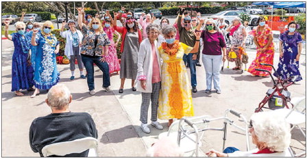 Hawaiian dance club performs outside LW gates