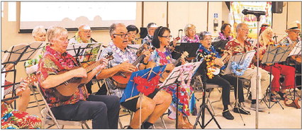 Aloha Club celebrates with group ukulele performance