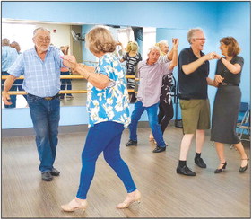 Dancers learn cha-cha and swing