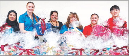 Volunteers create 100 gift baskets for residents